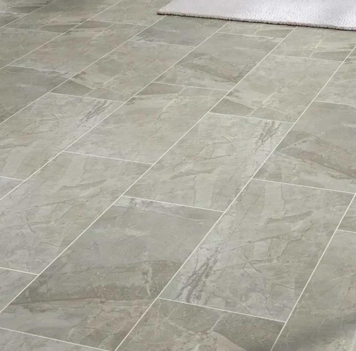 Newly installed glazed ceramic tile flooring.