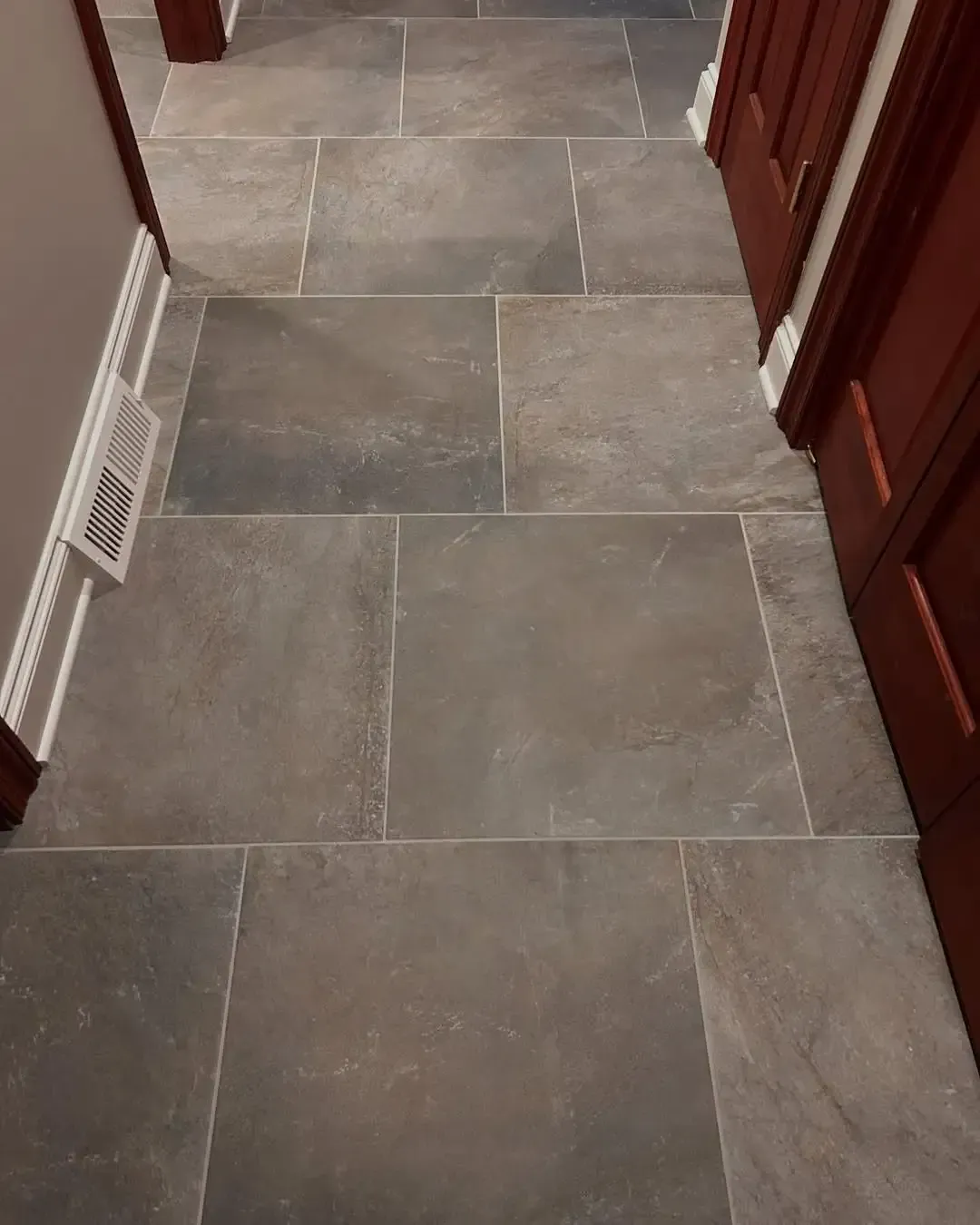 Professionally installed large format tile flooring installation service.