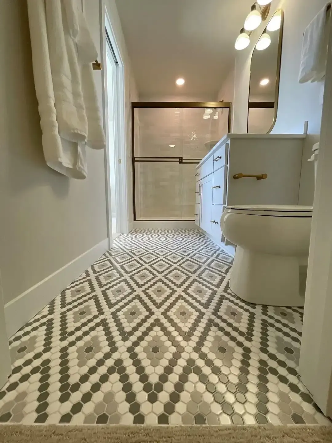 Newly installed mosaic ceramic tile flooring installation service.