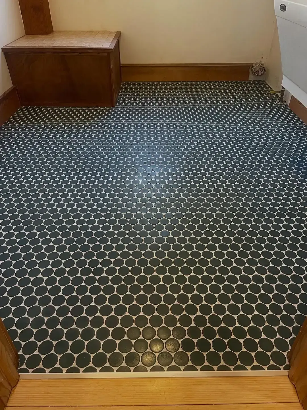 Expertly installed mosaic ceramic tile floor installation service.