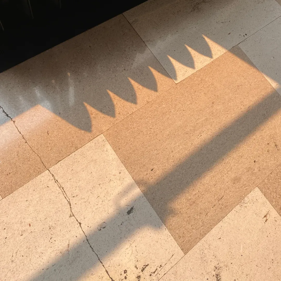 Cracked ceramic tile flooring being fixed.