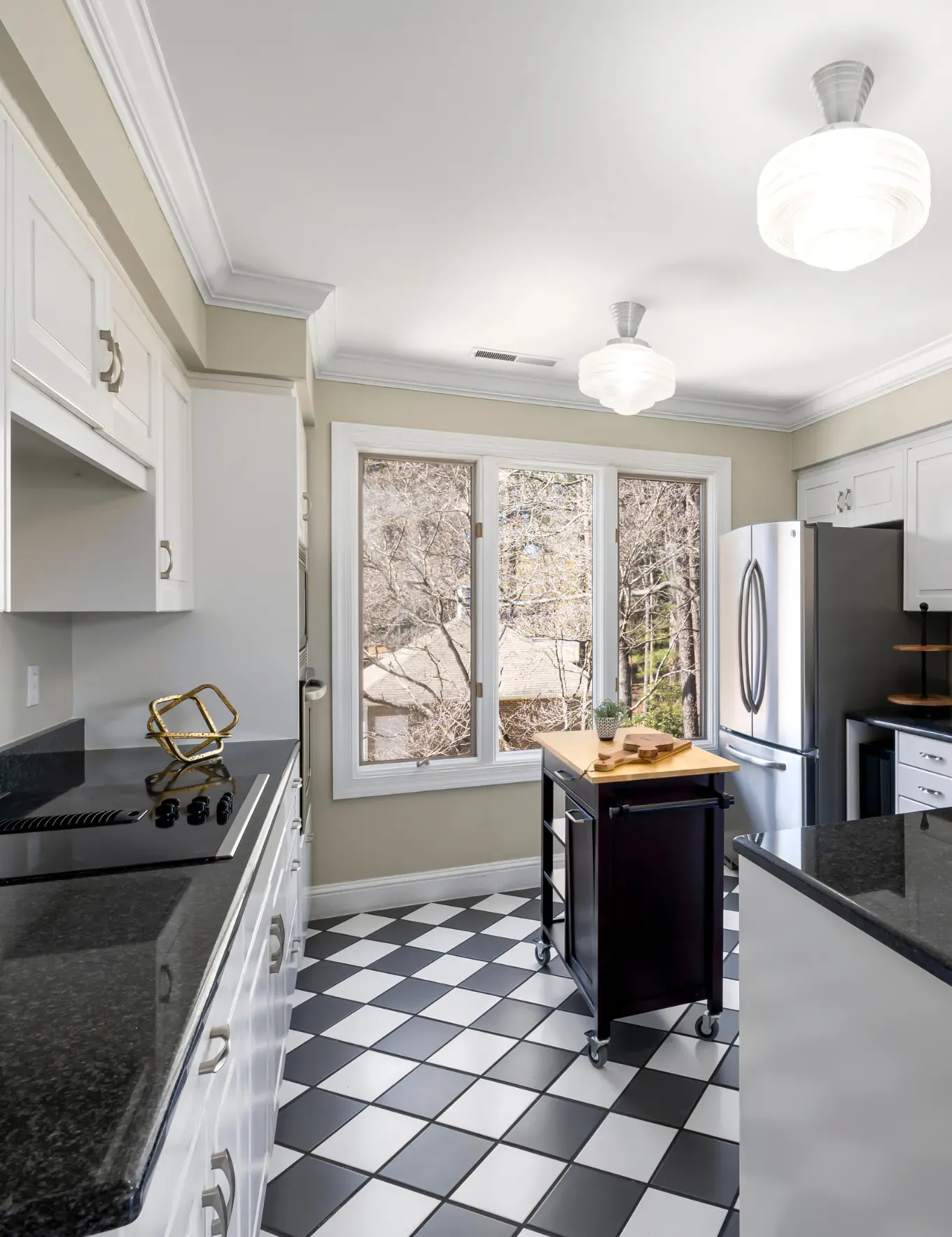 Newly installed ceramic tile flooring in residential kitchen.