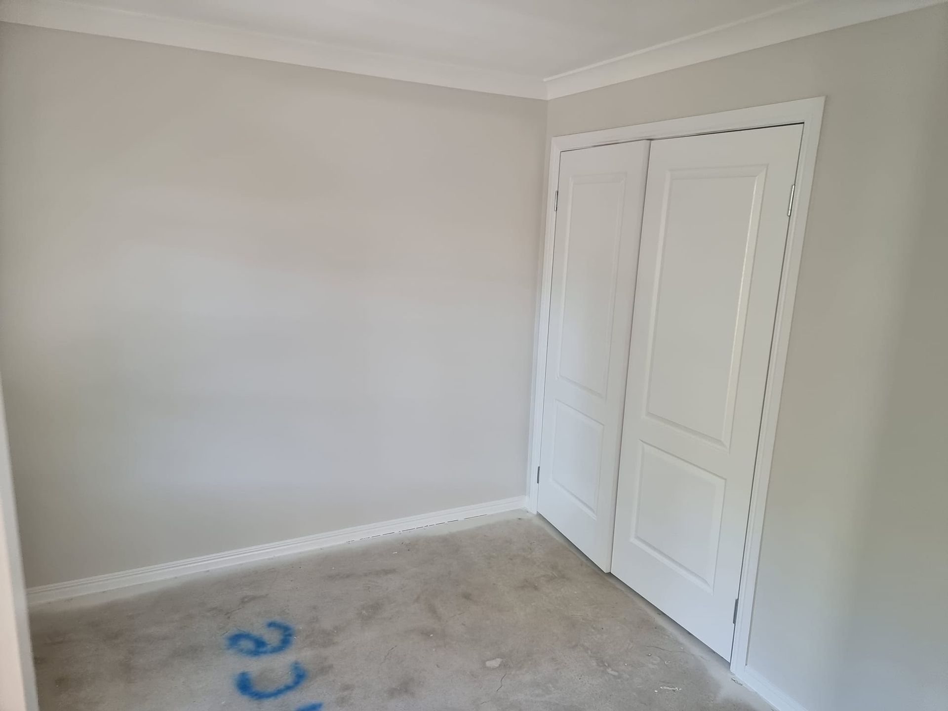 An Empty Room With White Walls And A Closet — LMS Painting & Maintenance Pty Ltd In Nelson Bay, NSW