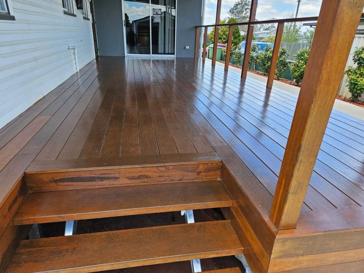 A Wooden Deck With Stairs Leading Up To It — LMS Painting & Maintenance Pty Ltd In North Lambton, NSW