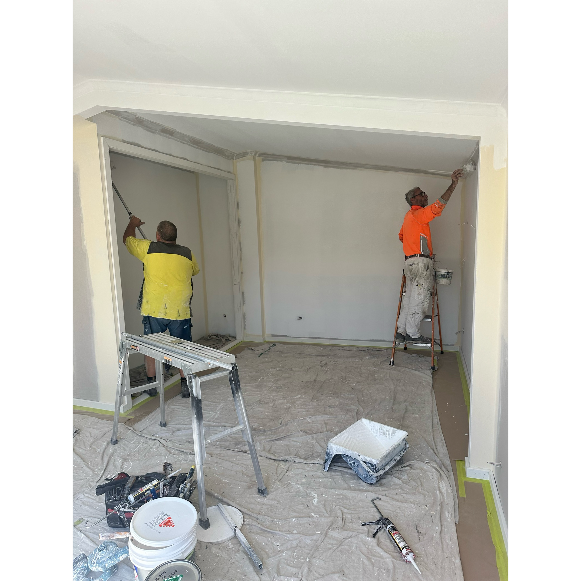 Painters at work inside a home — LMS Painting & Maintenance Pty Ltd In North Lambton, NSW