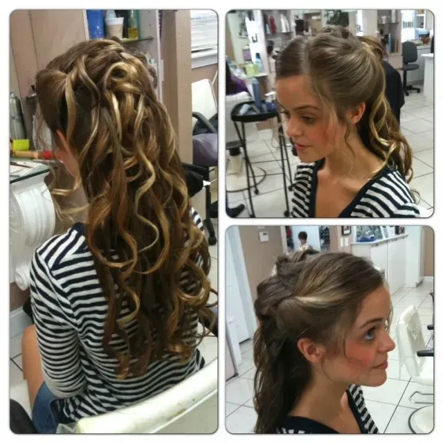 A woman in a striped shirt has her hair in a ponytail