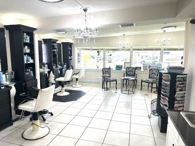 A salon with a lot of chairs and tables