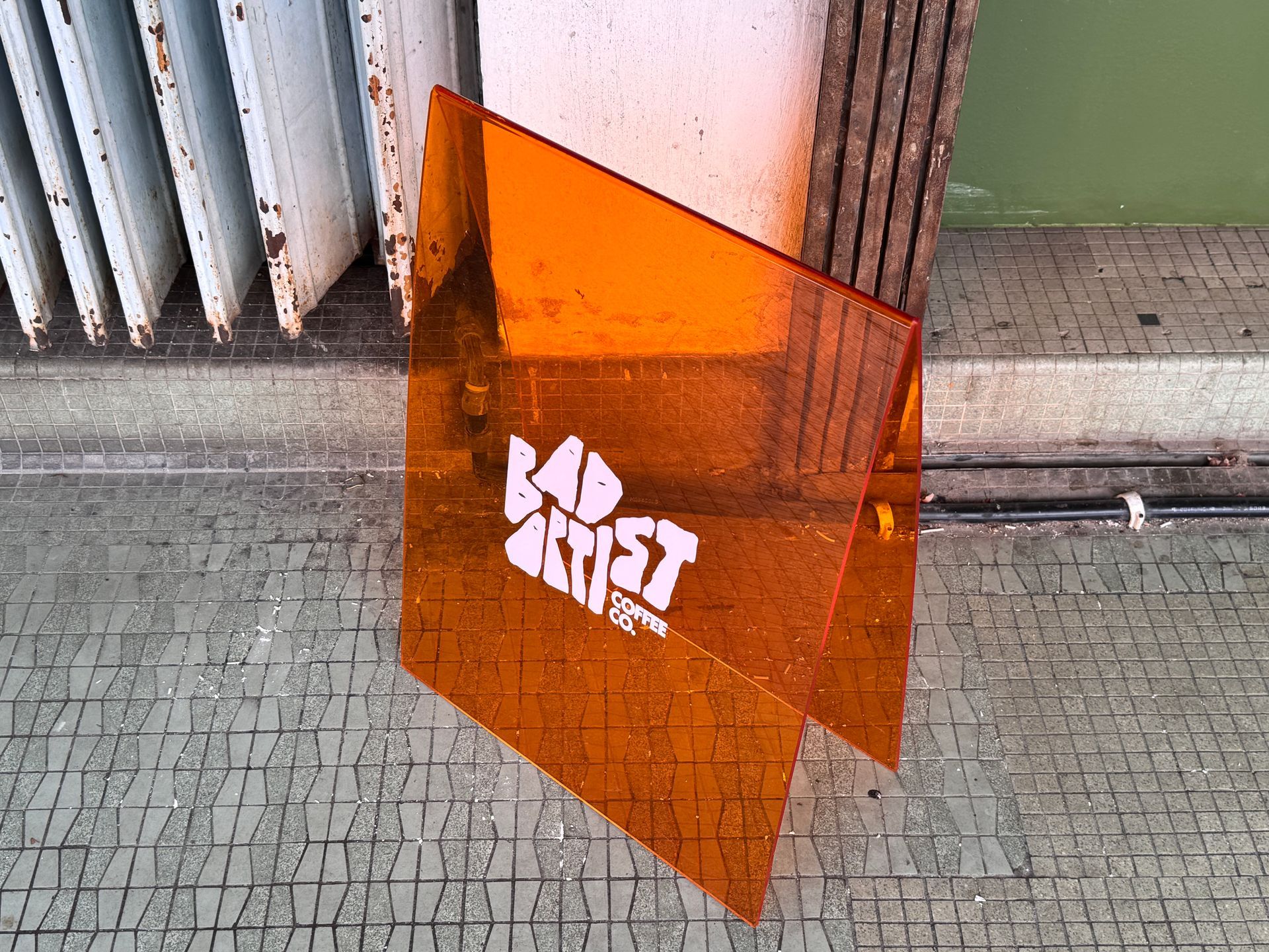 Orange, transparent sign with white 
