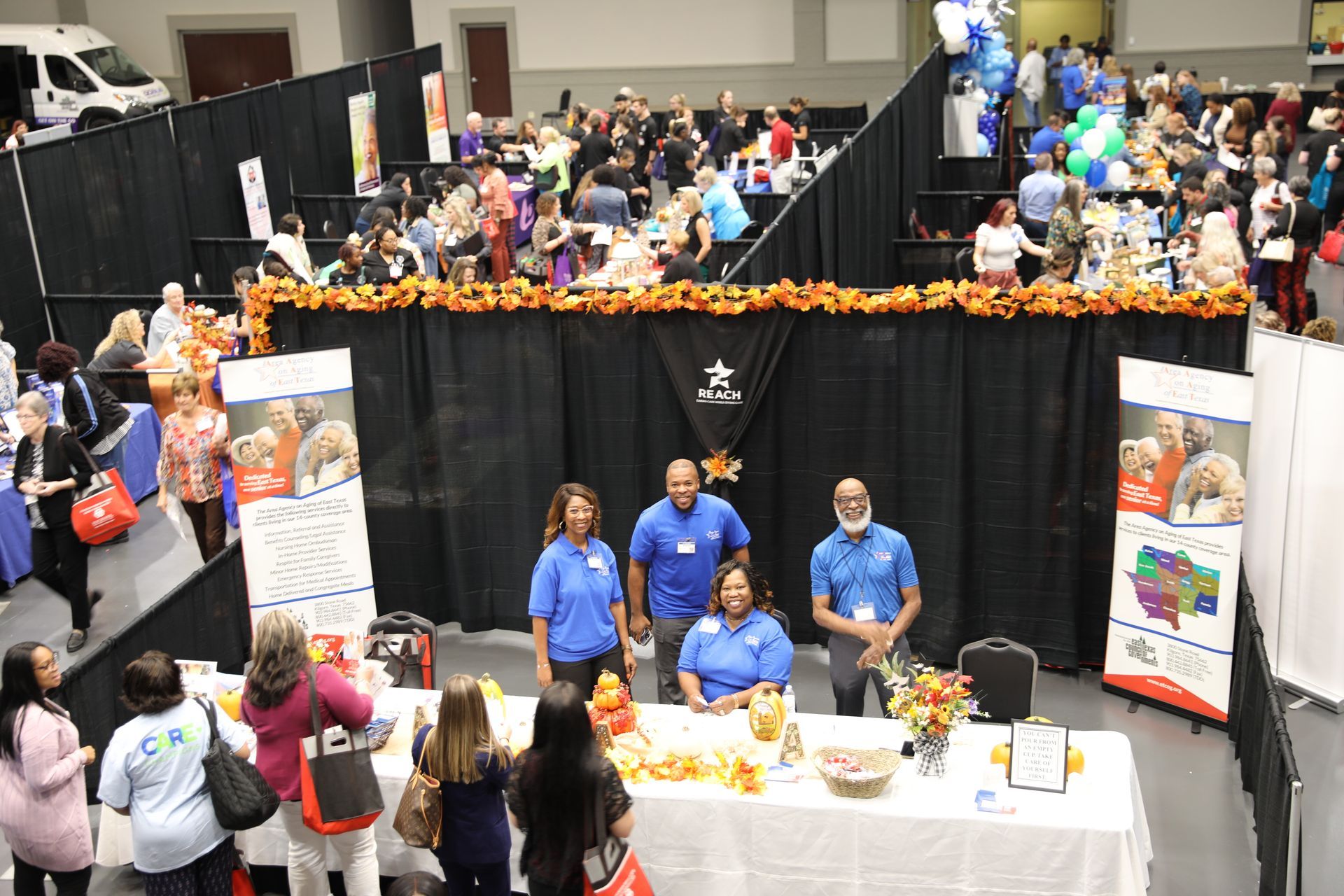 conference exhibit room full of people visiting booths