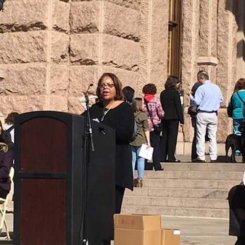 Aging director speaking on capitol steps