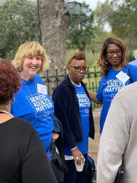 A group of women wearing blue shirts that say senior adults matter