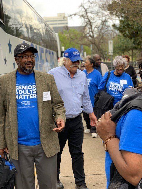 A group of people wearing blue shirts that say senior adults matter