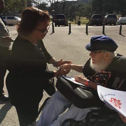Aging director with volunteer at capitol