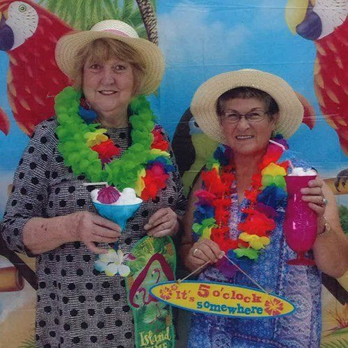 Volunteers in luau clothing for conference