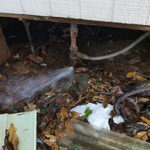 water leaking from pipe under house