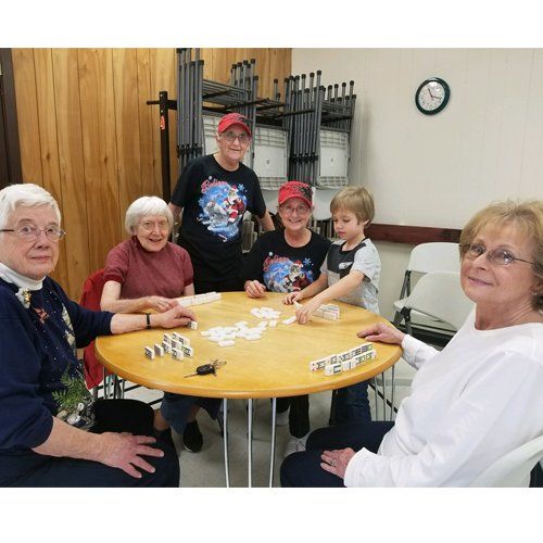 table with staff and volunteers