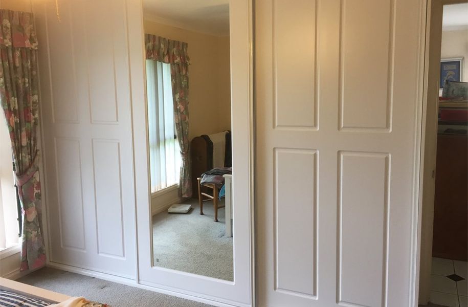 There is a large mirror in the closet in the bedroom.