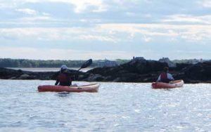 Two people kayaking on Goose Rocks Beach