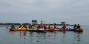 Group of people compressed in the middle while on kayak