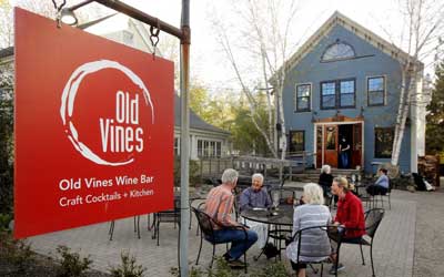 Group of people dining in in front of Old Vines Wine Bar