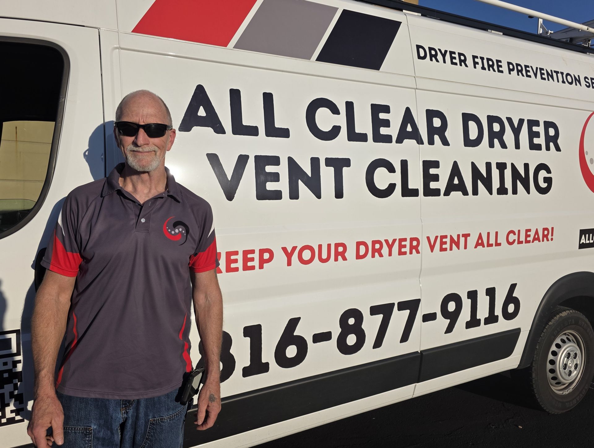 Man standing beside a van for All Clear Dryer Vent Cleaning with company logo and phone number
