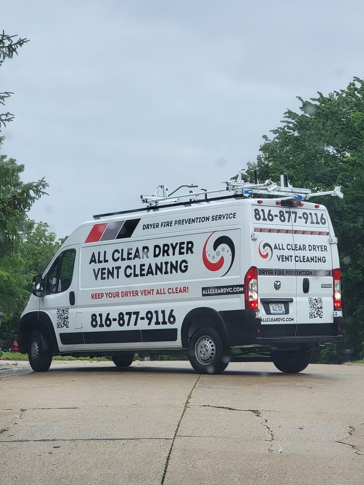 White All Clear Dryer Vent Cleaning van parked on a driveway under cloudy sky.