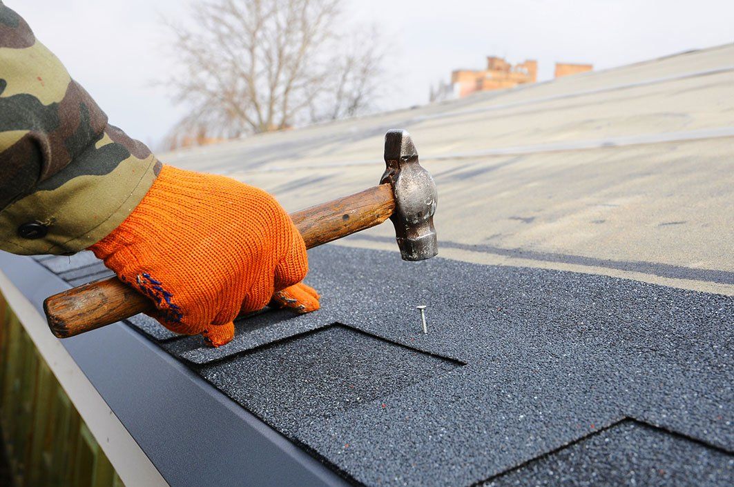 Roofing contractor fixing roof - Roofing Contractor in Westbrook, ME