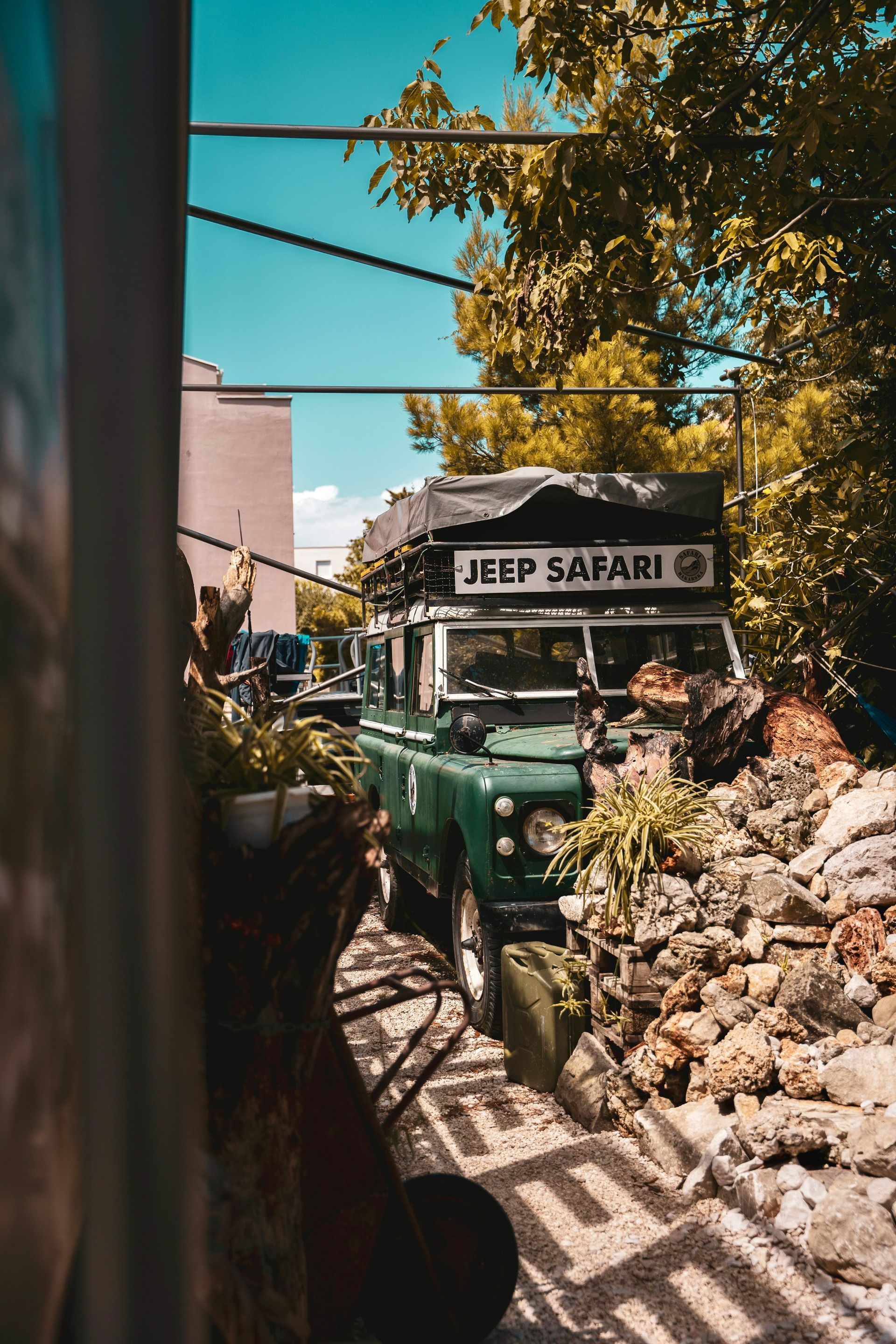 A vintage green Land Rover with a 