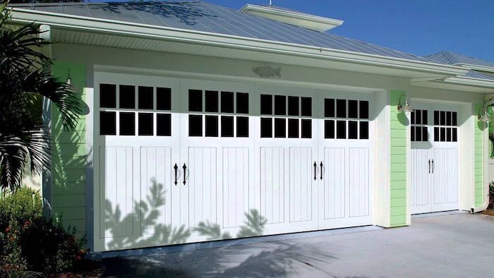 double row windows in carriage house garage doors
