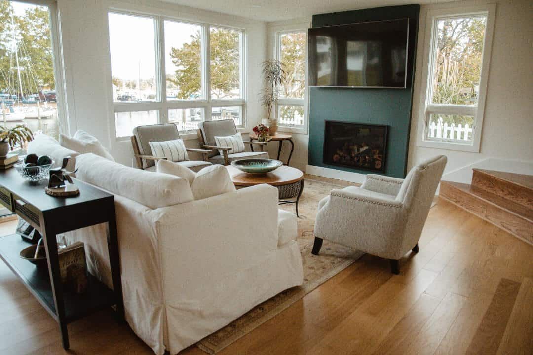 A living room filled with furniture and a fireplace.