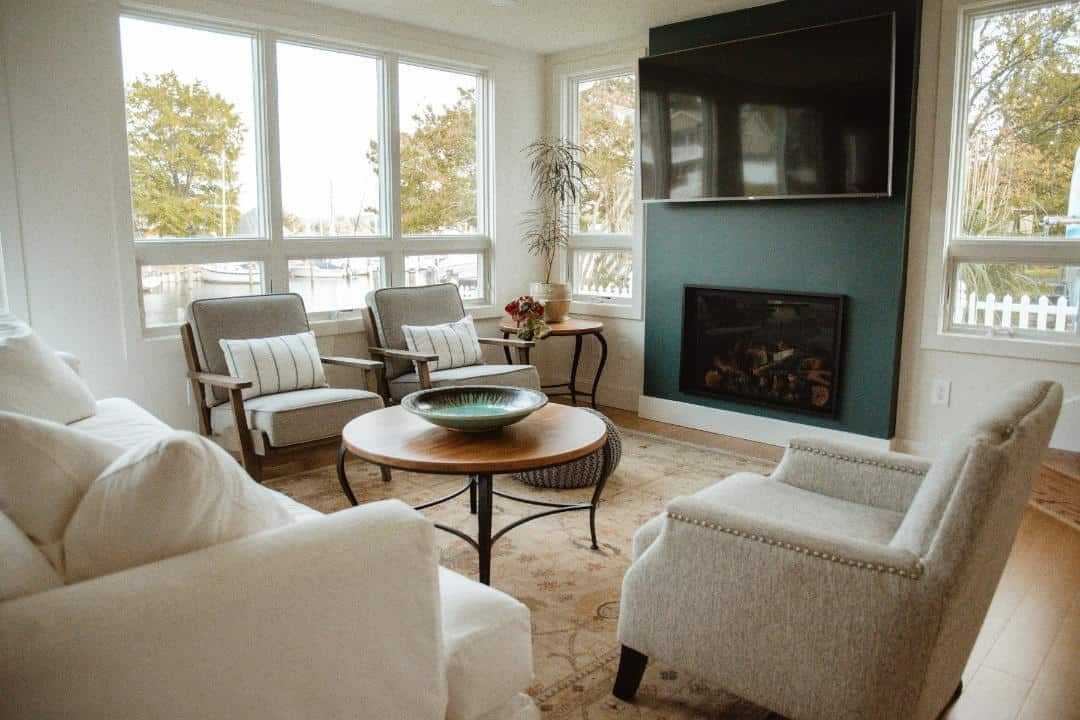 A living room filled with furniture and a fireplace.