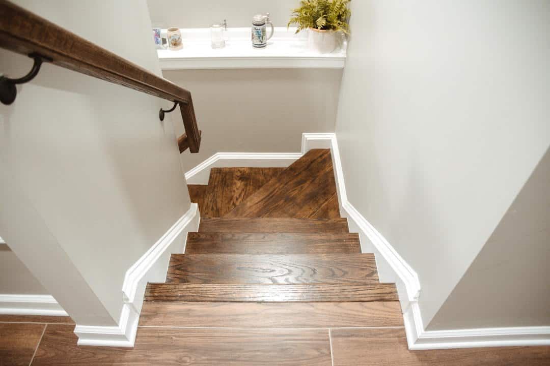 A wooden staircase leading up to a second floor in a house.