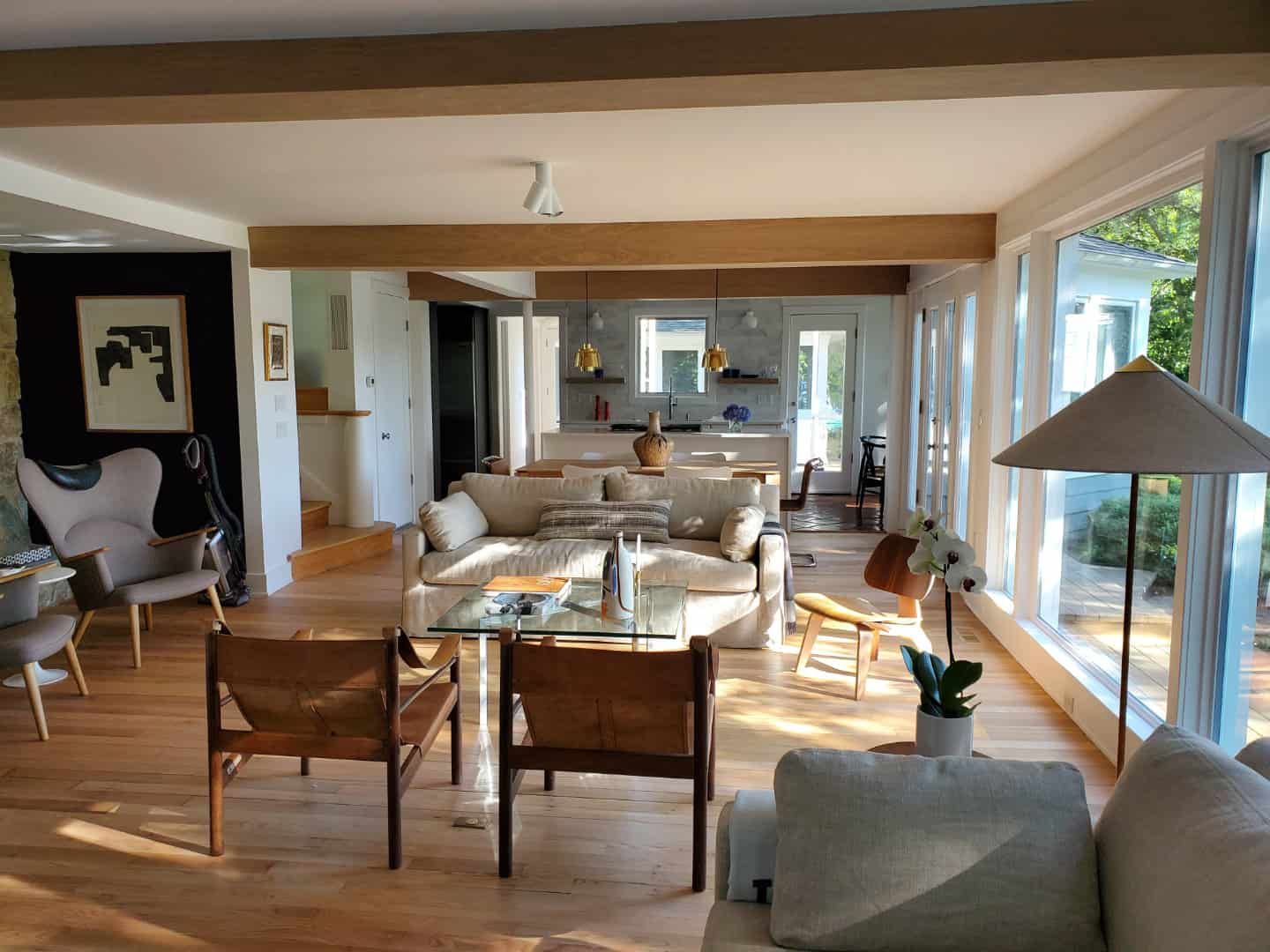 A living room filled with furniture and a lot of windows