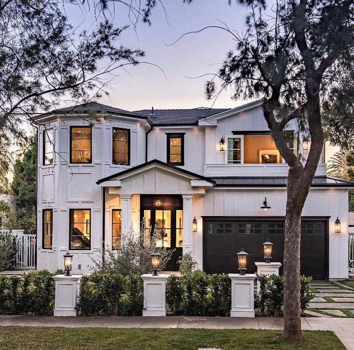 Large brown garage doors with windows. 
