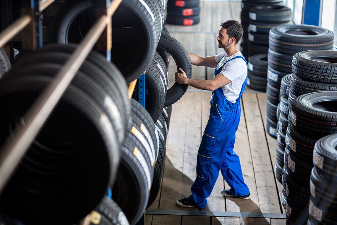 Man Choosing Tire — Laredo, TX — Outlaw Wheels & Tires