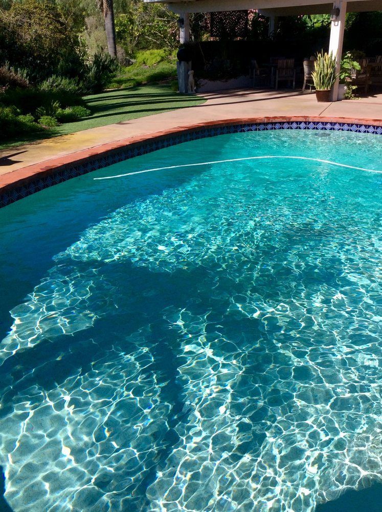 A large swimming pool filled with clear blue water