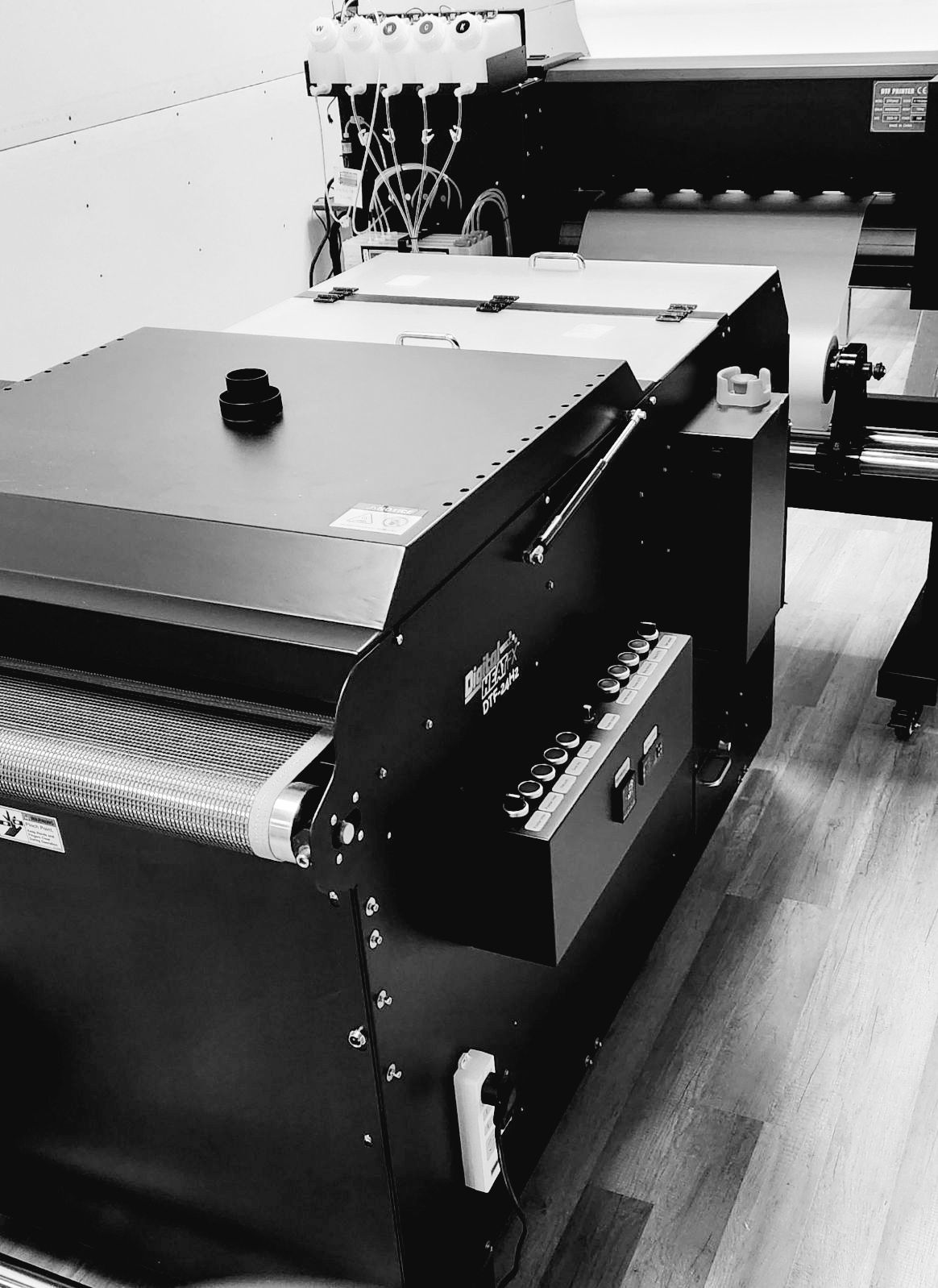 Worker Pressing Ink on Frame — Marshalltown, IA — Family Graphics with Tone