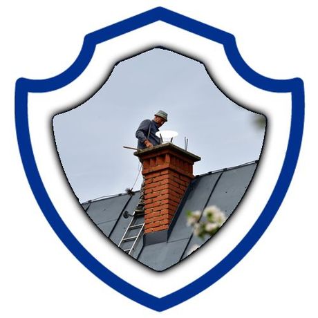 A man is working on a chimney on top of a building