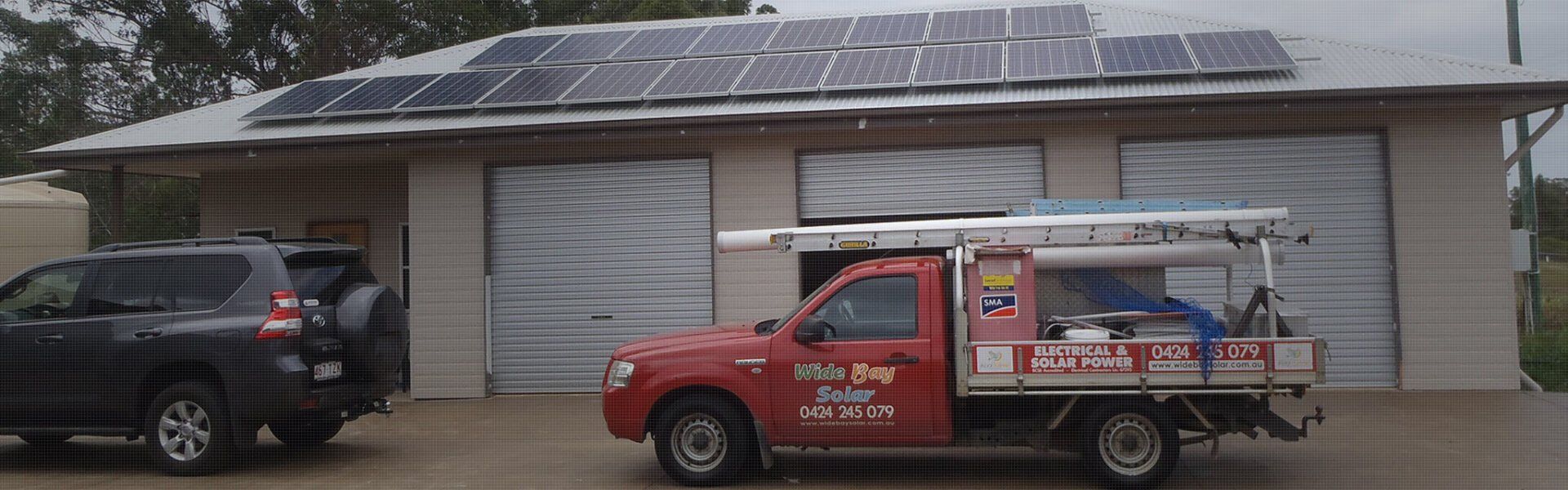 Solar Panels On A Roof And Wide Bay Solar Service Vehicle — Solar Panels in Hervey Bay, QLD
