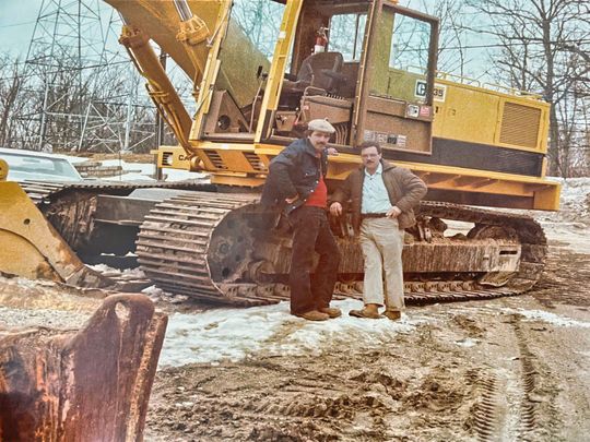 Alex's sons Frank and Sandy assumed control in 1970 with Frank heading up materials and real estate while Sandy oversaw excavation construction.