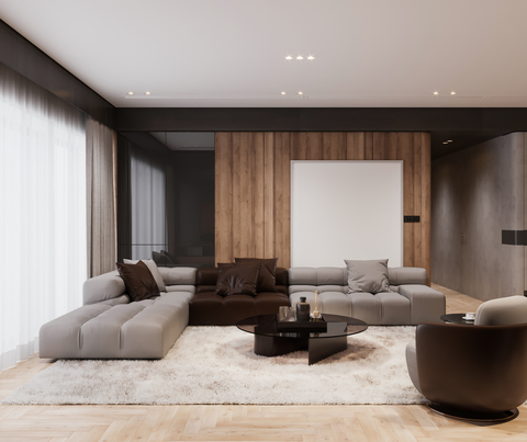 Modern minimalist living room with gray sofas, wood paneling, white rug, and large windows.