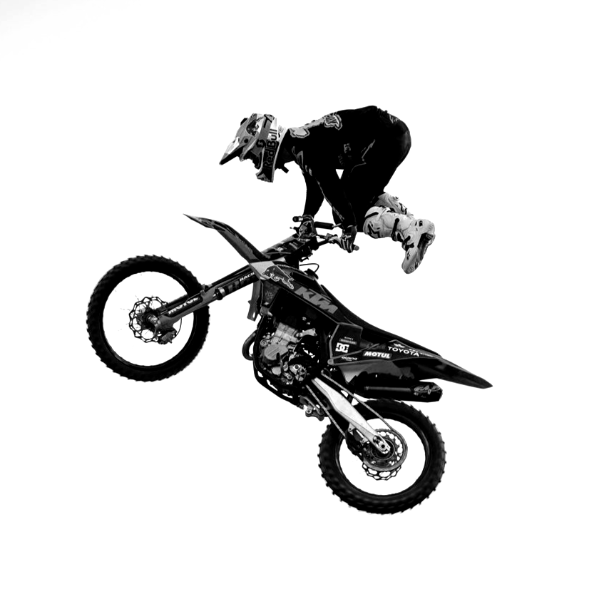 Motorcross rider performs a wheelie, black and white, in mid-air.