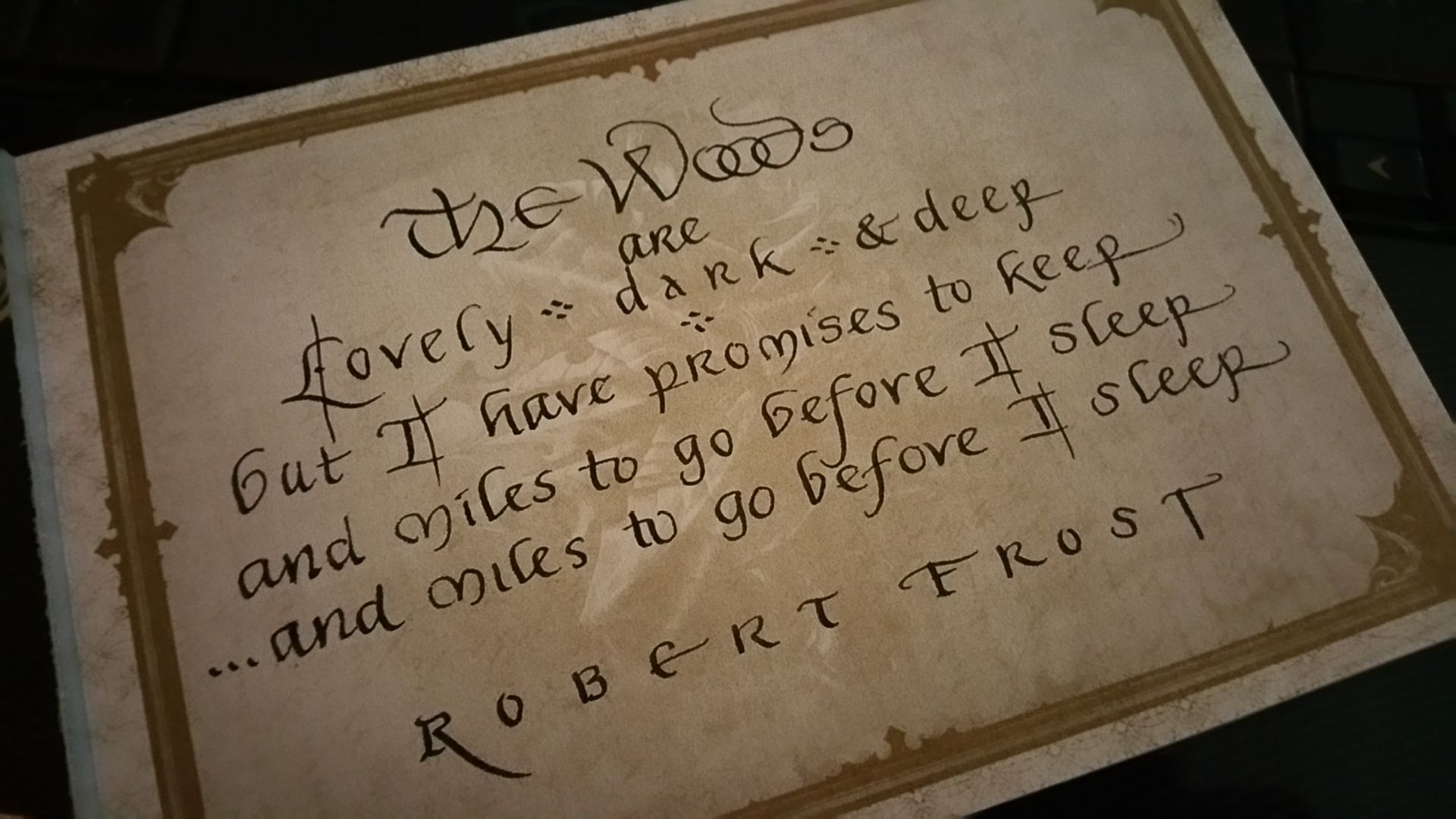 A piece of paper with a quote from robert frost