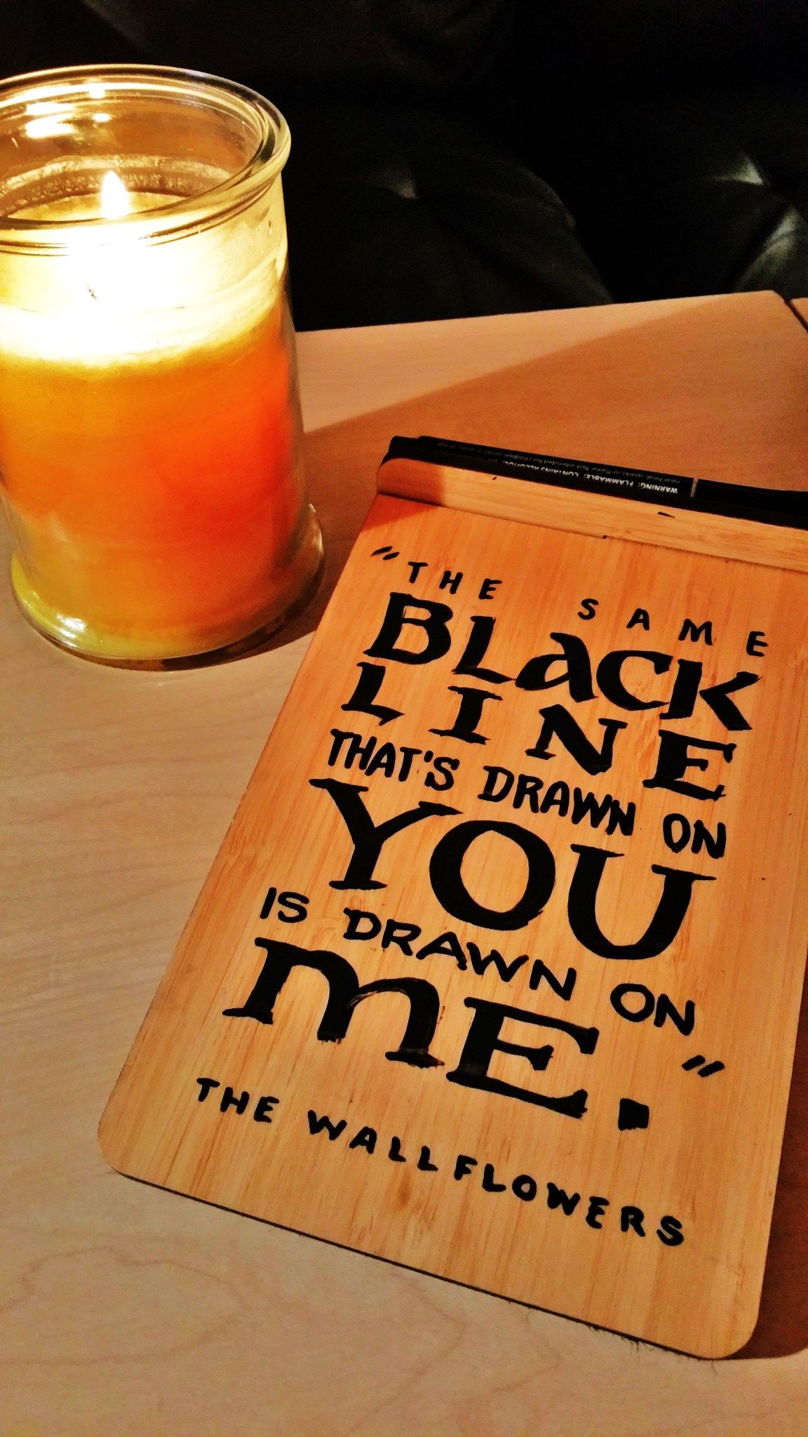 A notepad that says the name black line that 's drawn on you is drawn on me