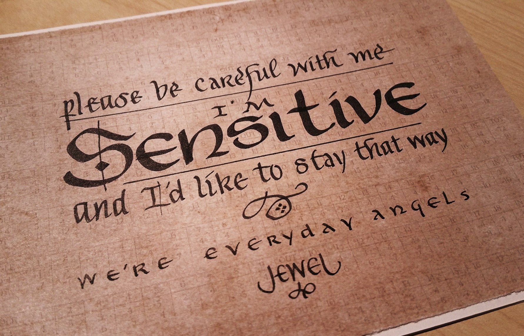 A piece of paper that says please be careful with me i 'm sensitive and i 'd like to stay that way