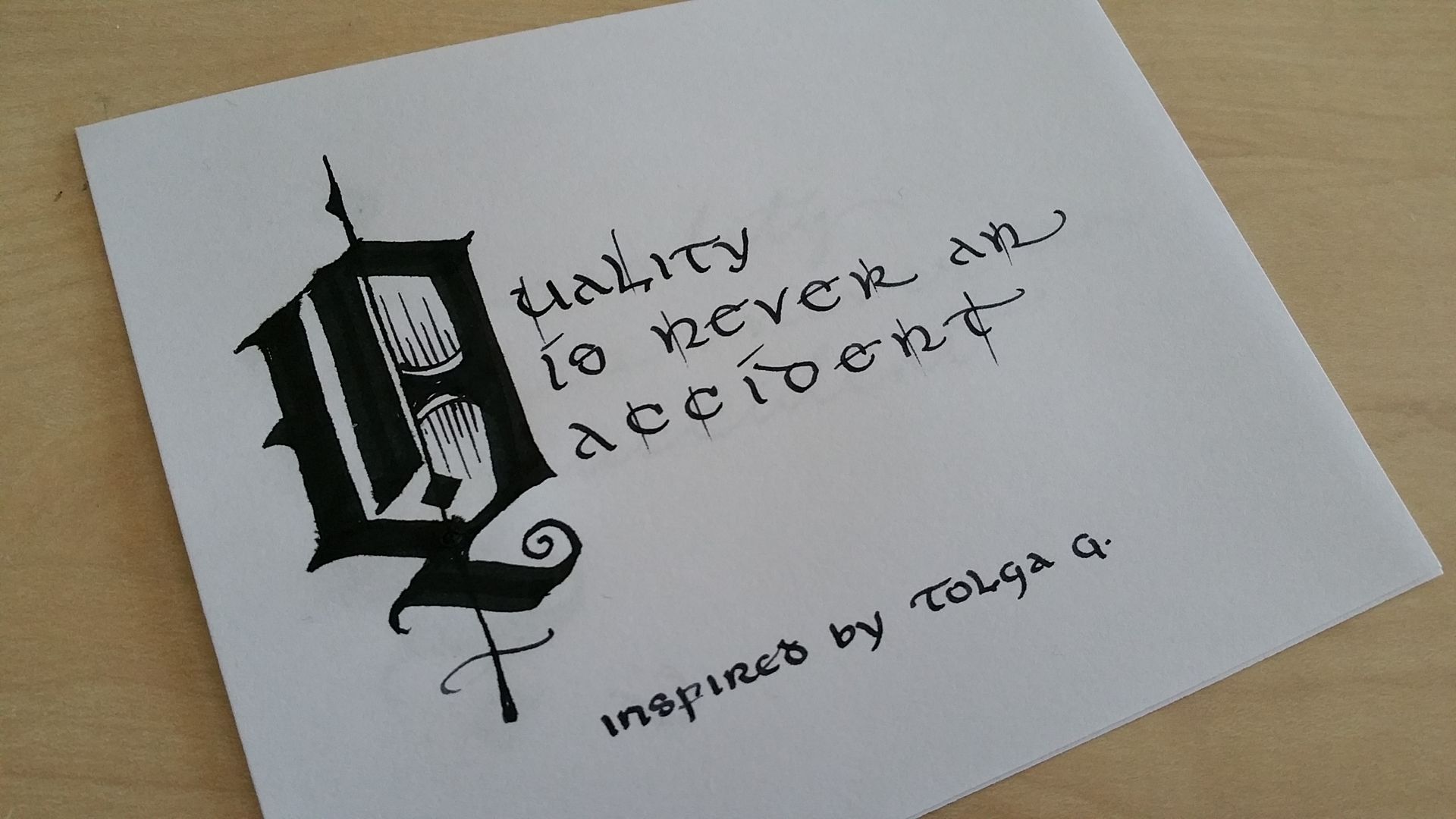 A piece of paper that says quality to never an accident