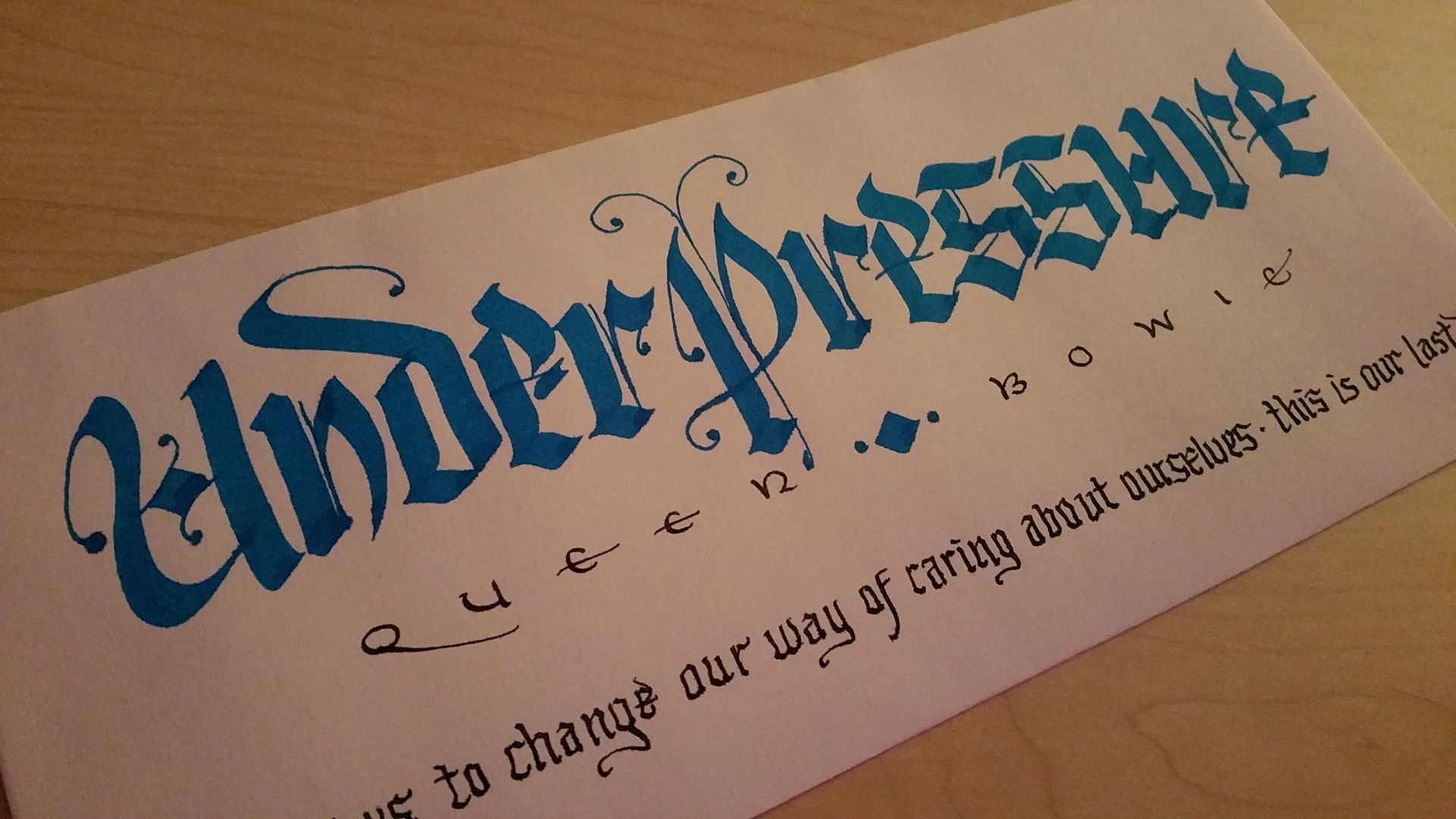 A piece of paper that says under pressure on it