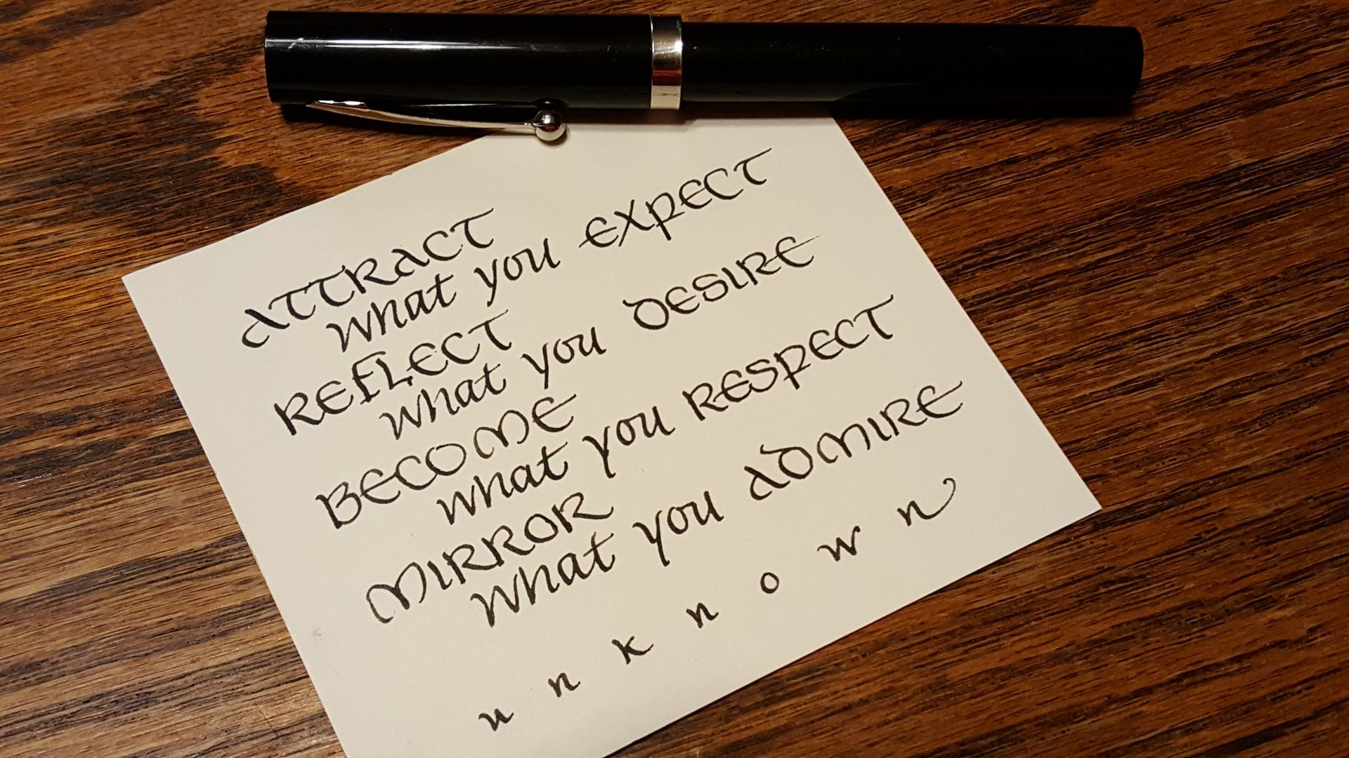 A piece of paper that says attract what you expect reflect what you desire become what you respect mirror what you admire