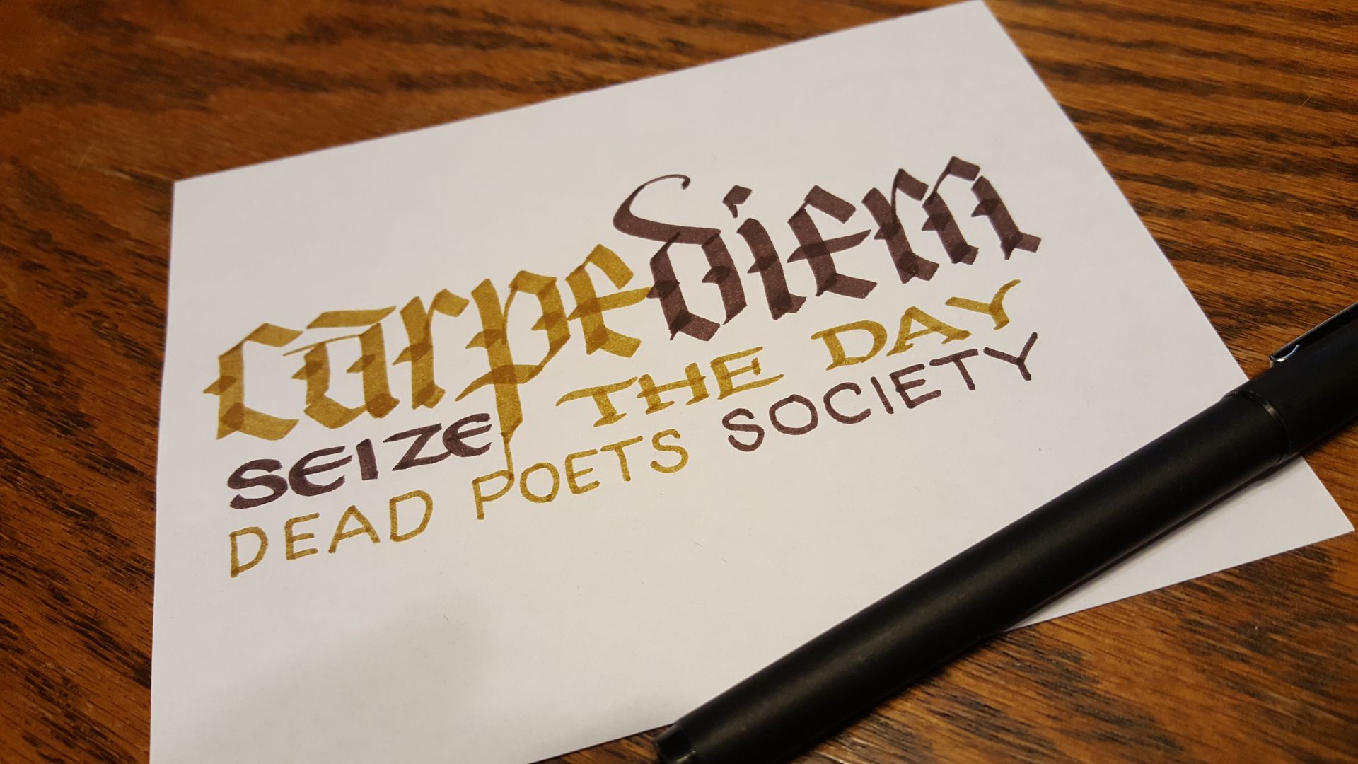 A piece of paper with carpe diem written on it