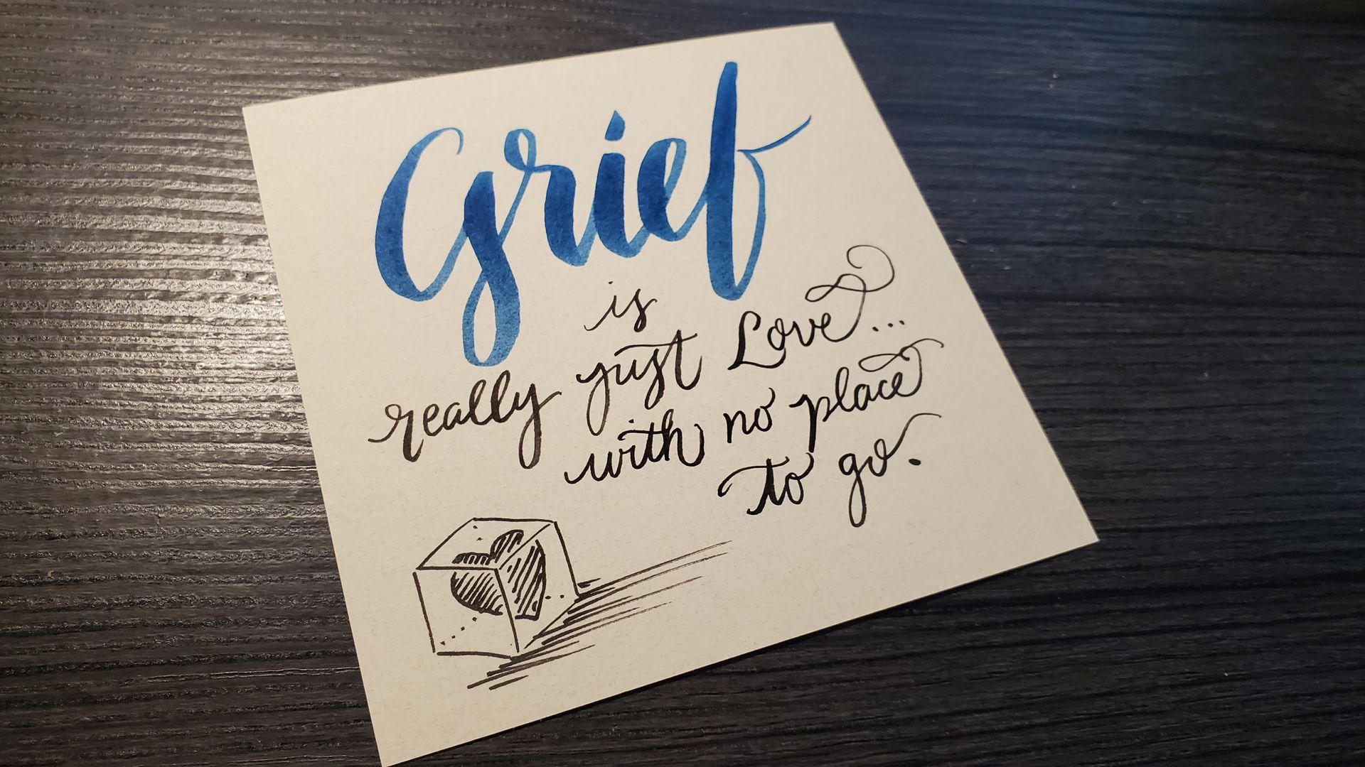 A piece of paper with grief written on it